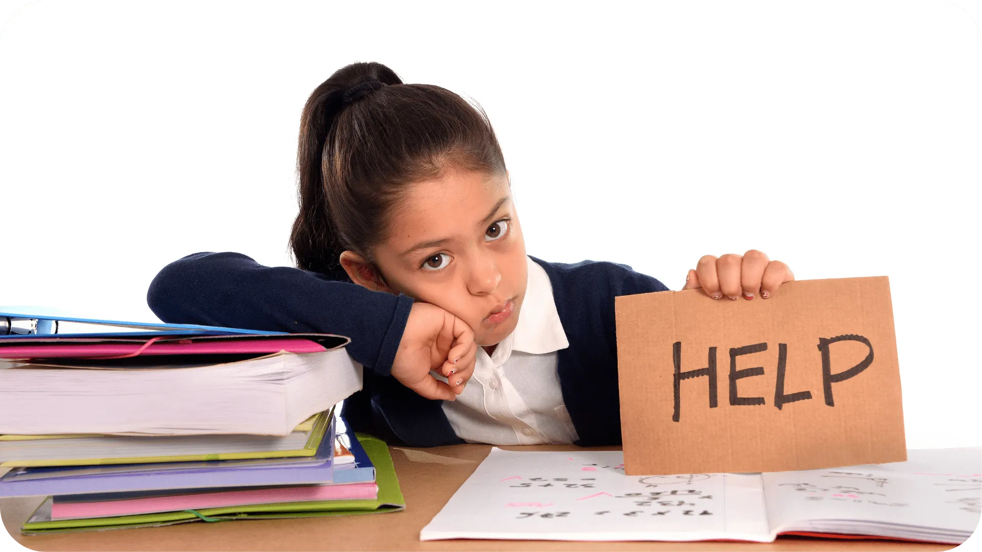 Child looking fed up, leaning on a pile of books, holding up a cardboard sign that says 'help'.
