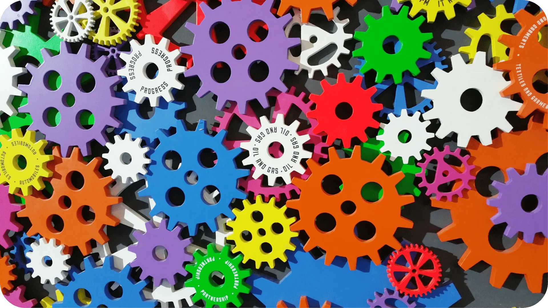 A collection of colourful cogs overlapping.