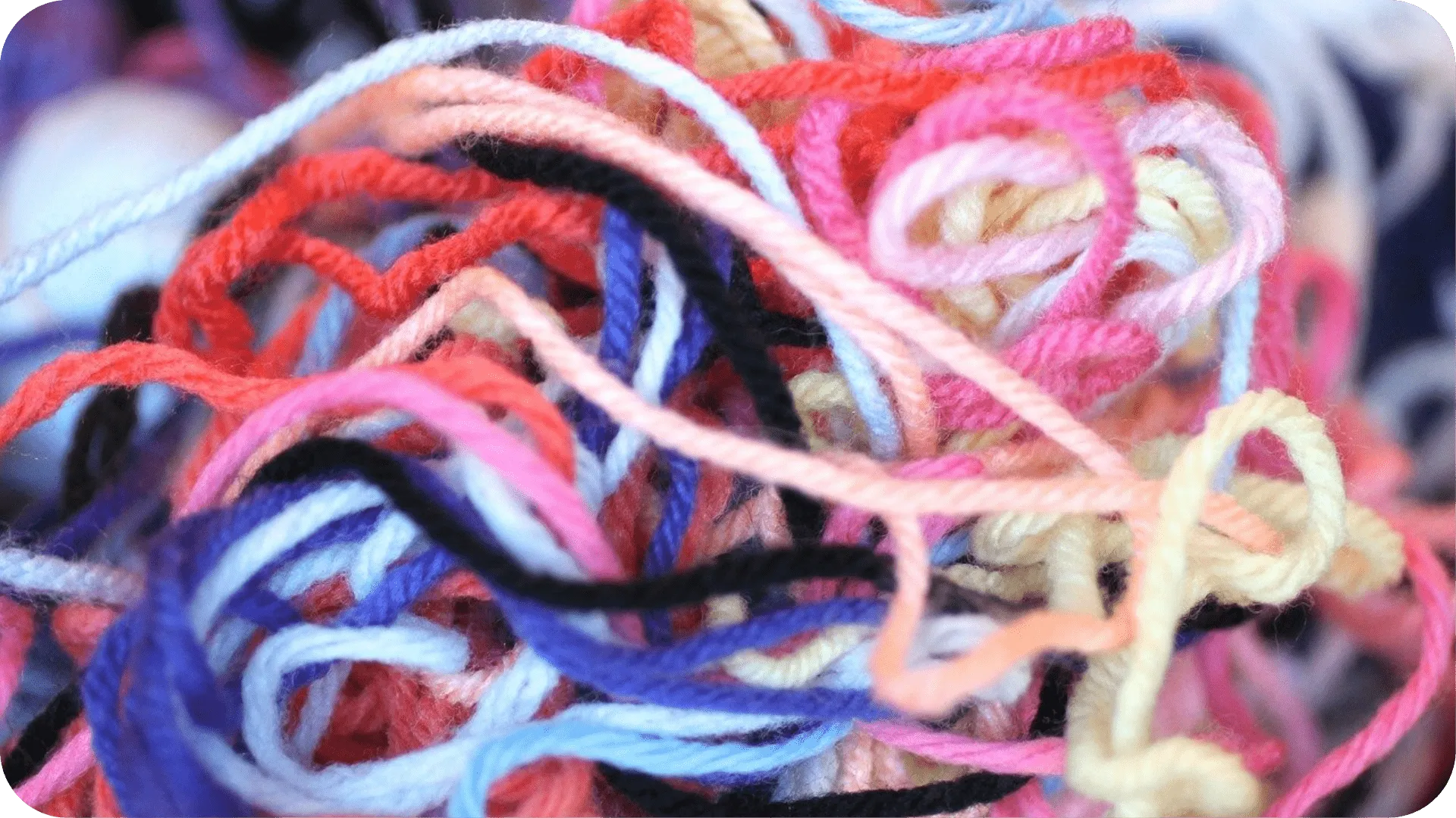 Brightly coloured yarn, tangled up.