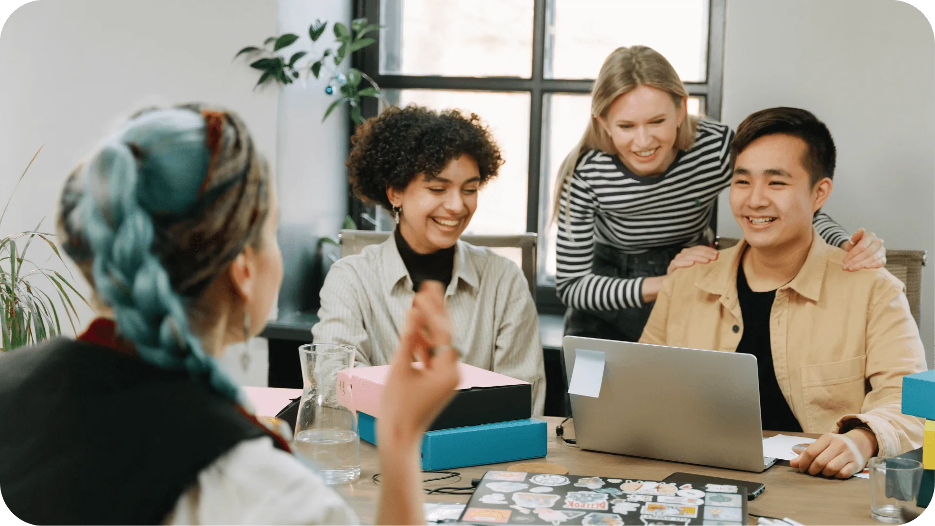 A diverse team communicating in the workplace.